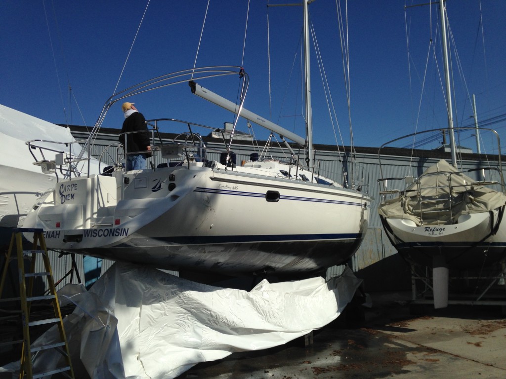 The wind did the rest for us by pulling the remaining wrap off the hull!