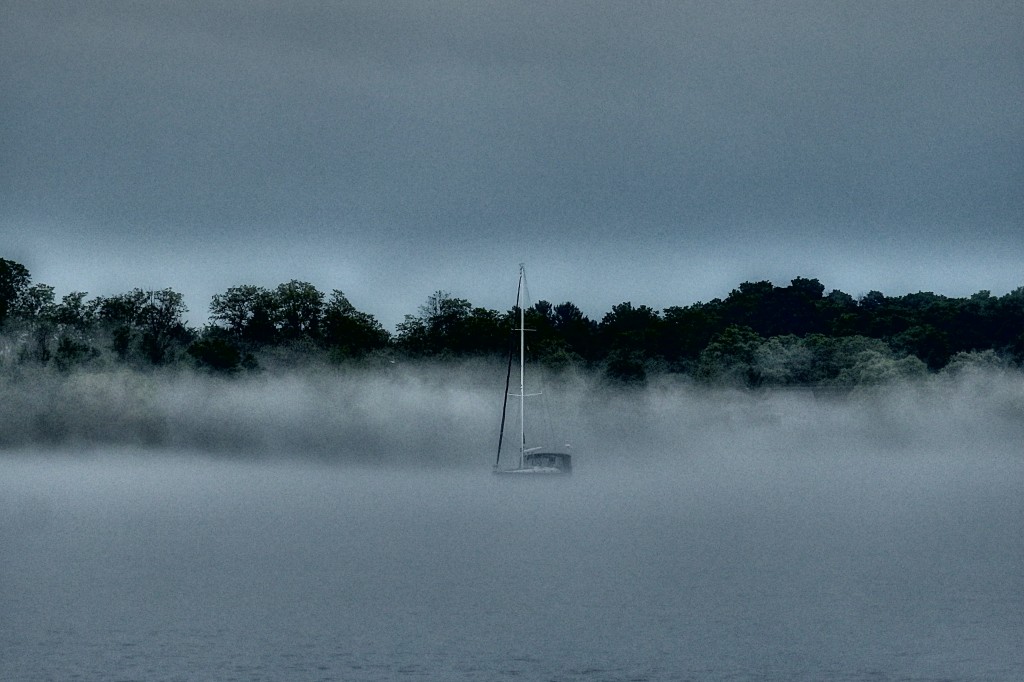 Sailboat lost in the fog