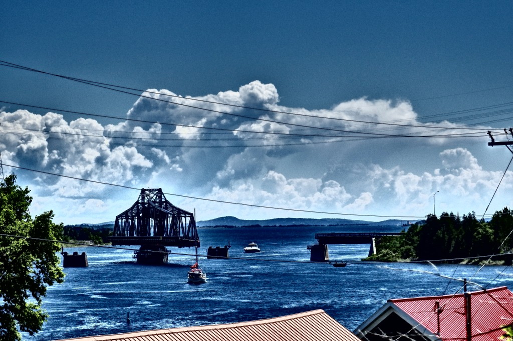 Great shot of the rotating bridge the mediates the flow of boat traffic on the channel. 