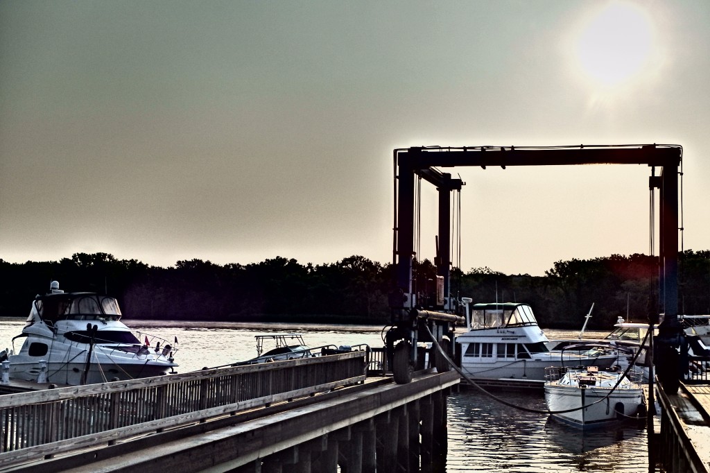 Carpe Diem sitting idly as she waits for her mast to be put back on down the river. 